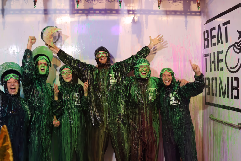 Team Get Foxy celebrating their Cash Bomb win, covered in slime