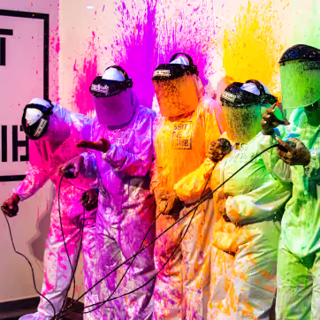 People enjoying Beat The Bomb covered in paint