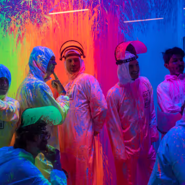 People enjoying Beat The Bomb covered in paint